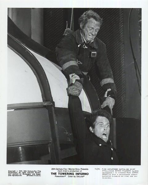 Steve McQueen as Fire Chief Michael O'Hallorhan 
struggles to save one of his men.